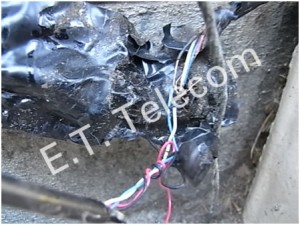 Twisted phone wiring wrapped in tape and left outside