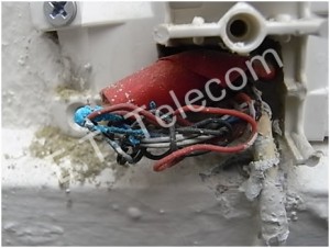 This is a phone socket wiring repaired using electrical tape. The ‘green ‘ is copper wire corrosion